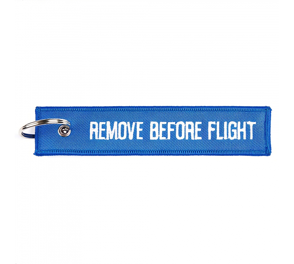Přívěsek "Remove Before Flight", 12,5 × 3 cm, modrý, Fostex Garments